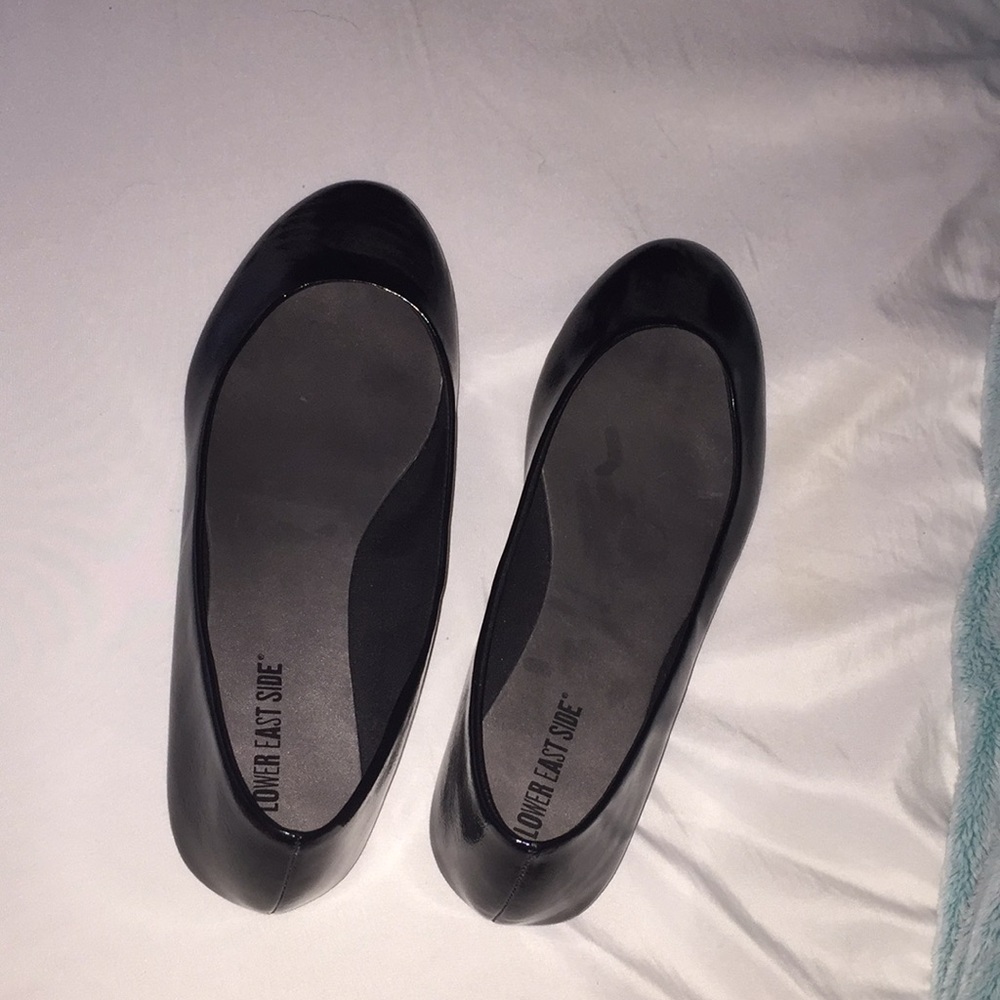 Shiny black flats
